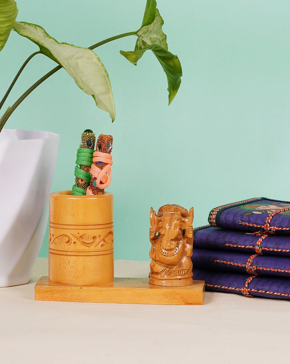 Handcrafted Wooden Pen Stand with Ganesh Figurine — false