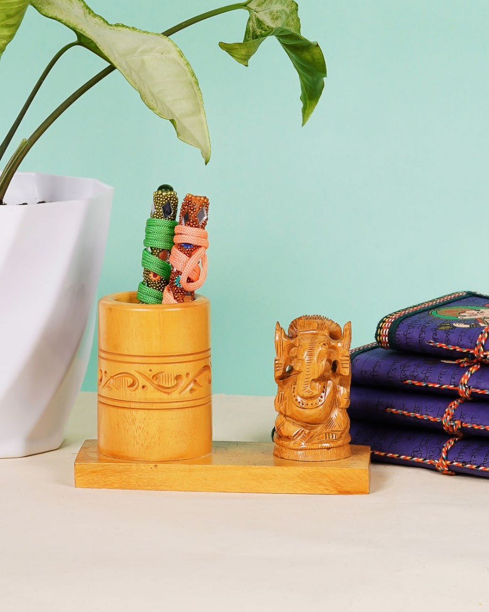 Handcrafted Wooden Pen Stand with Ganesh Figurine — false